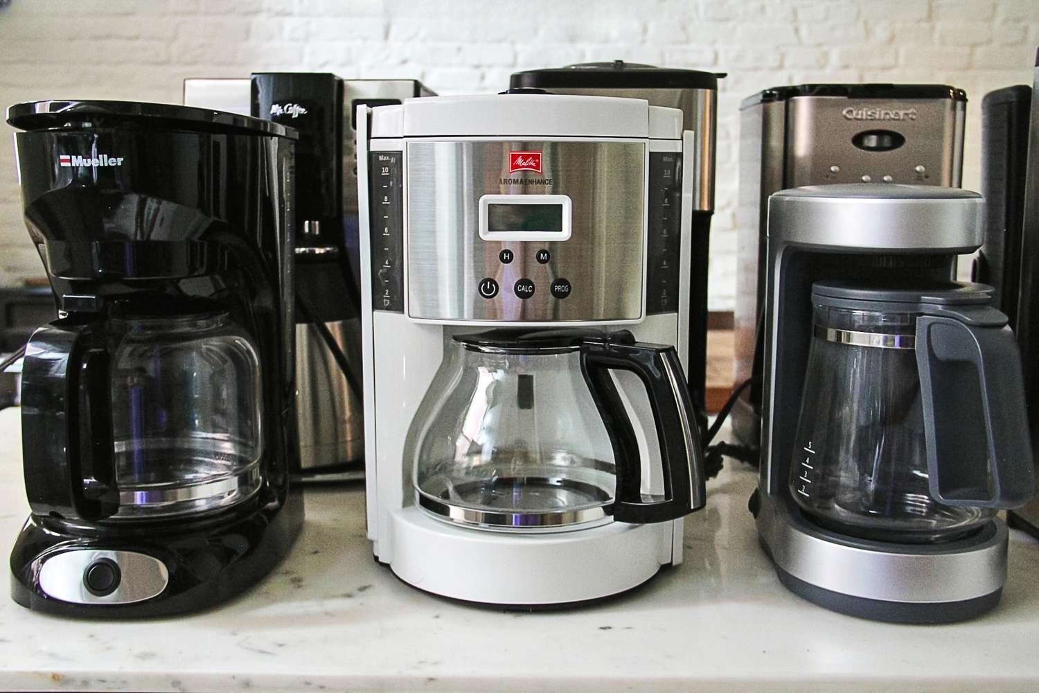 Coffee brewing equipment set up on a table for an instructional guide.