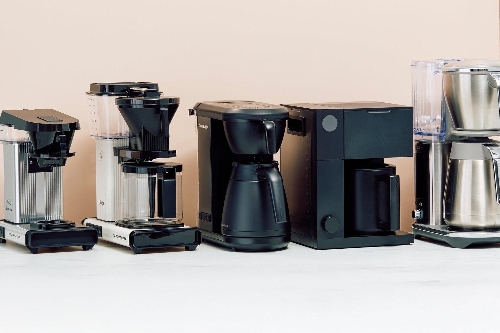 Adjusting the dose settings on a modern office single-cup coffee machine.